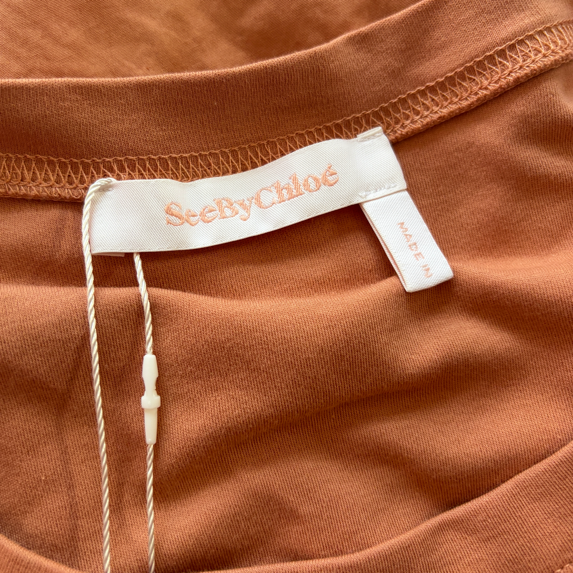 chloé light burnt orange ruffle top
